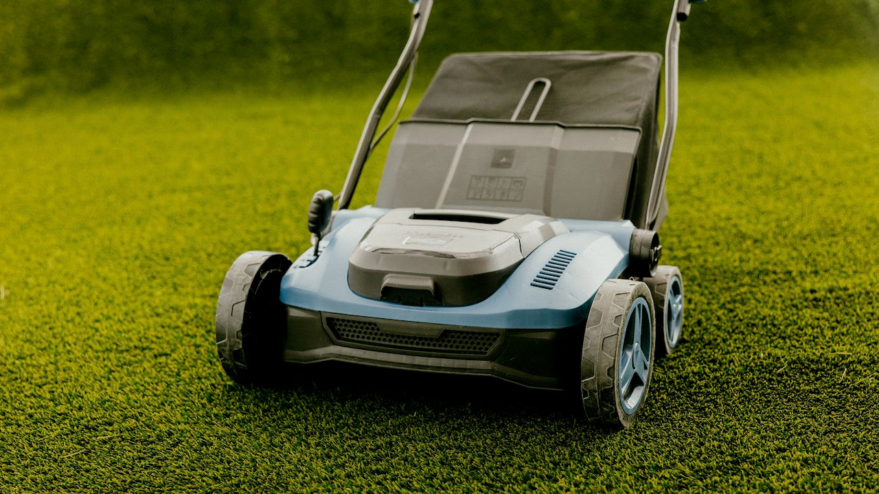 TURFSPIN™ Cordless Artificial Turf Sweeper on synthetic grass lifting fibers and removing debris